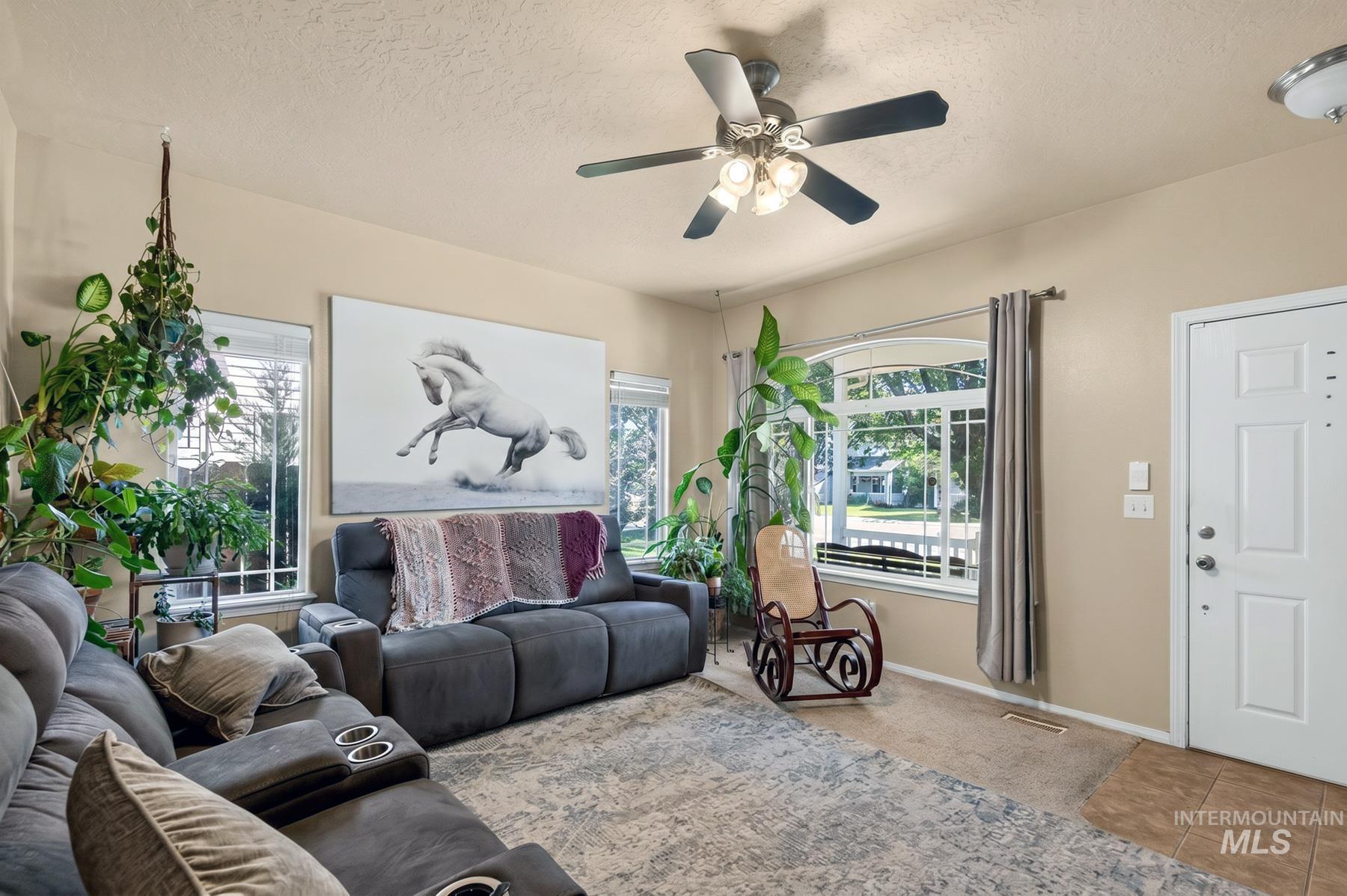 5020 Northrup Way Caldwell, ID 83607 - Photo 7 of 36 Bright living area with multiple windows providing natural light