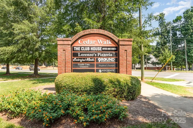 a view of a garden with large trees