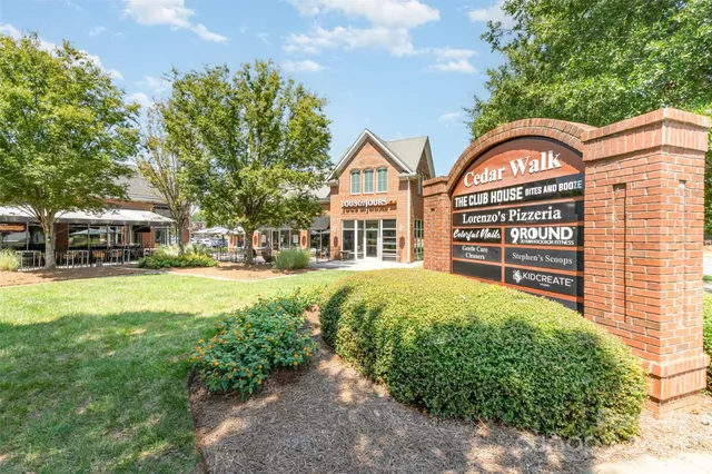 a view of a house with a swimming pool and a garden