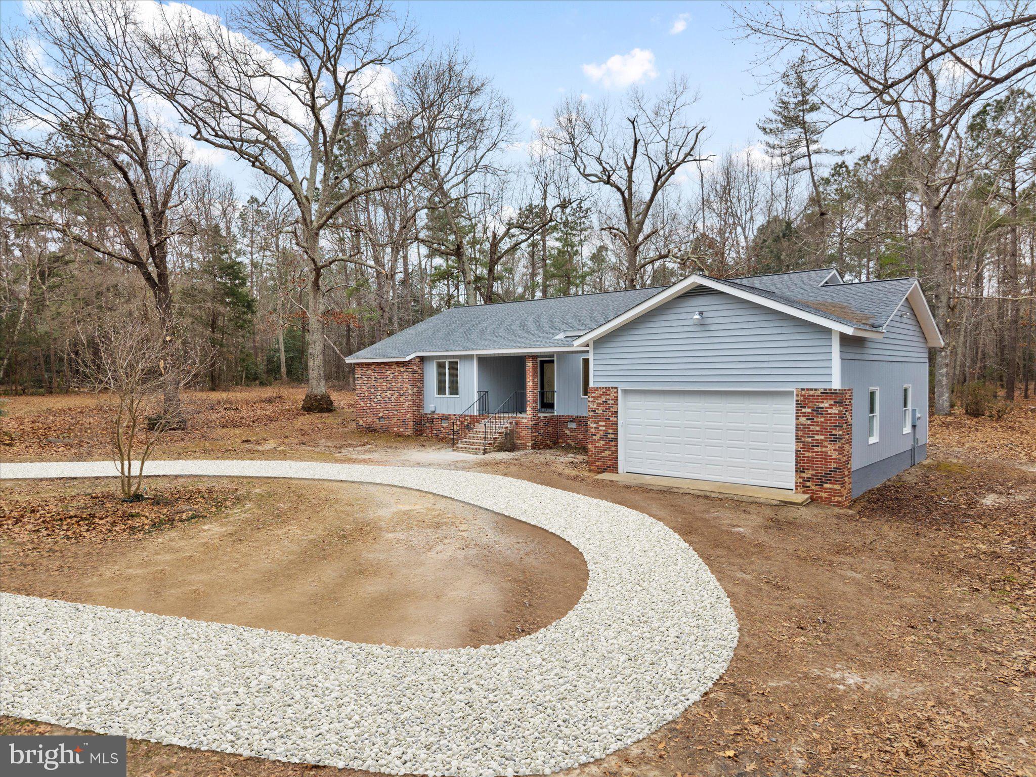 10009 River Road Petersburg, VA 23803 - Photo 2 of 59 a house view with a outdoor space