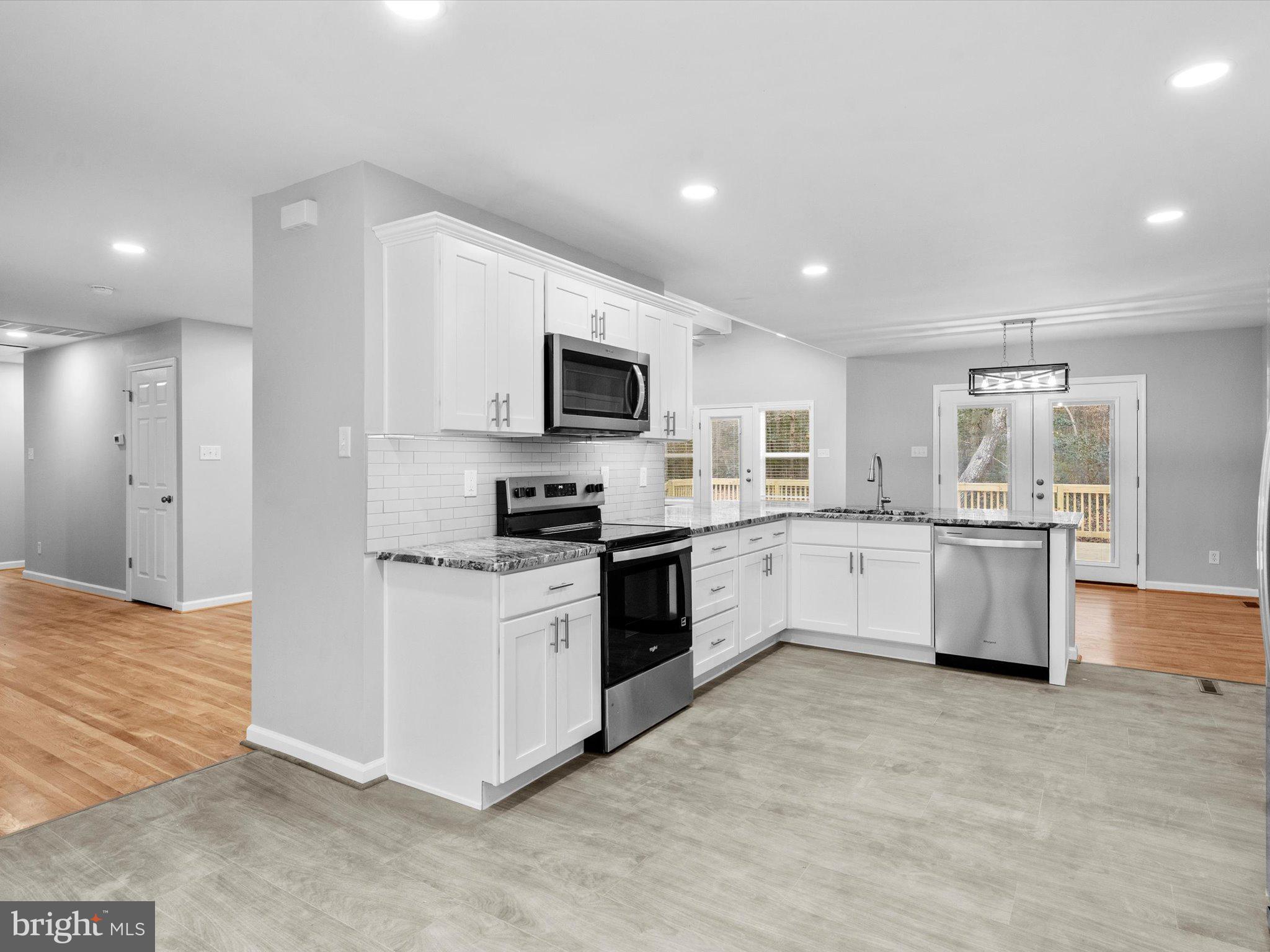 10009 River Road Petersburg, VA 23803 - Photo 22 of 59 a large kitchen with cabinets