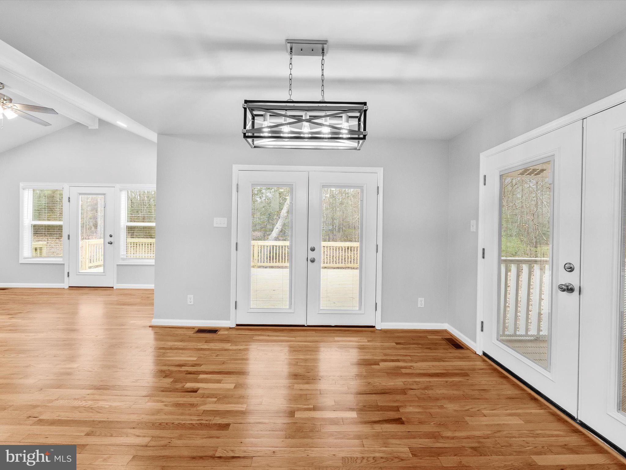 10009 River Road Petersburg, VA 23803 - Photo 24 of 59 an empty room with wooden floor and windows