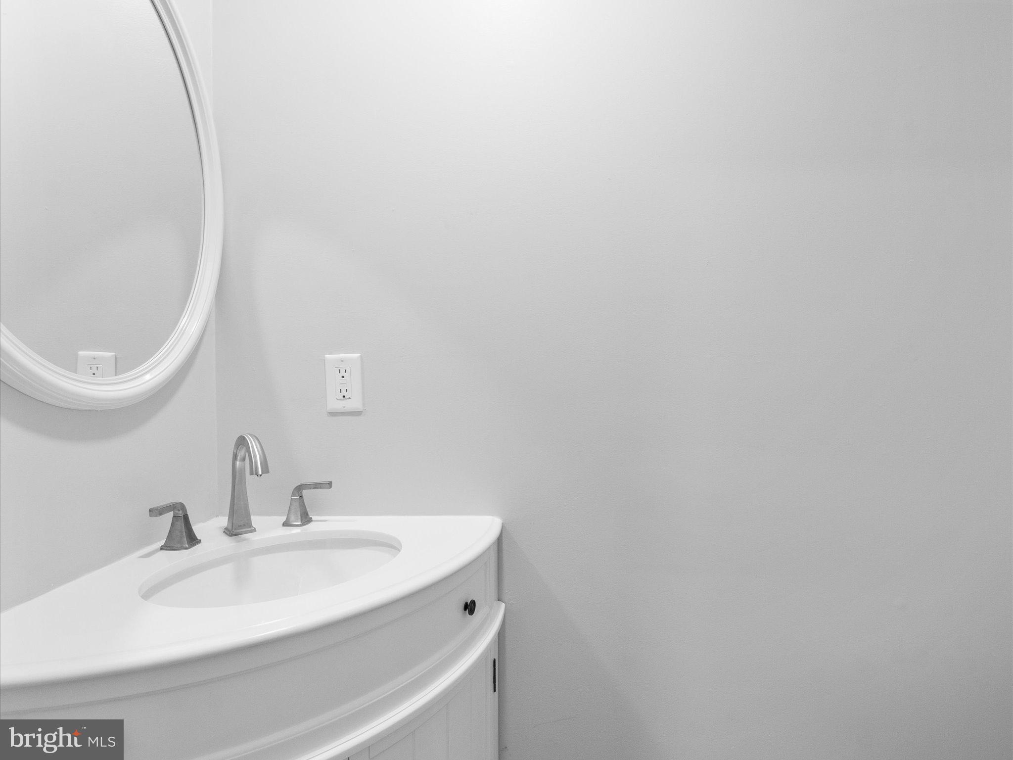 10009 River Road Petersburg, VA 23803 - Photo 26 of 59 a bathroom with a sink and a mirror