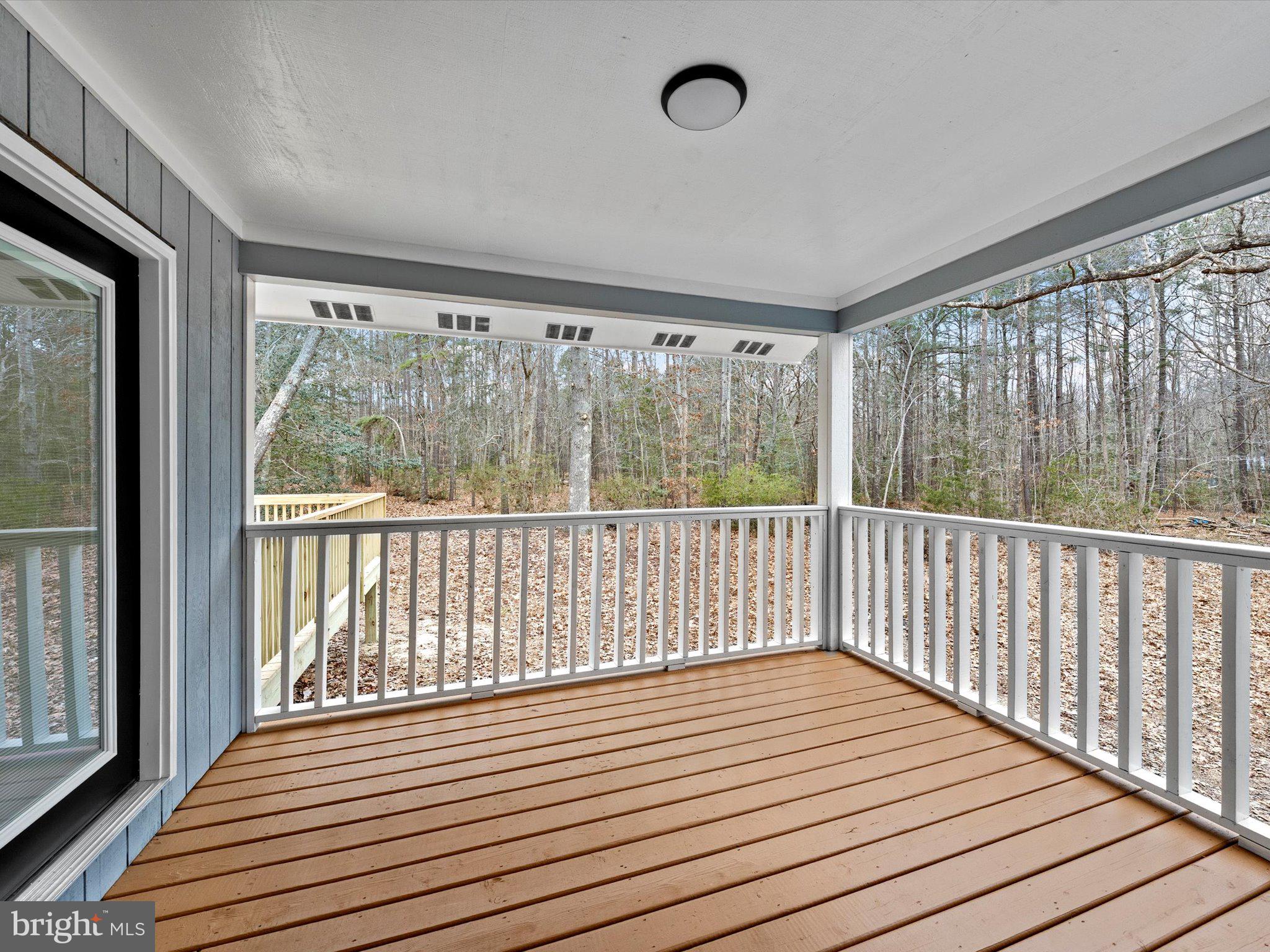 10009 River Road Petersburg, VA 23803 - Photo 41 of 59 a view of a balcony with wooden floor