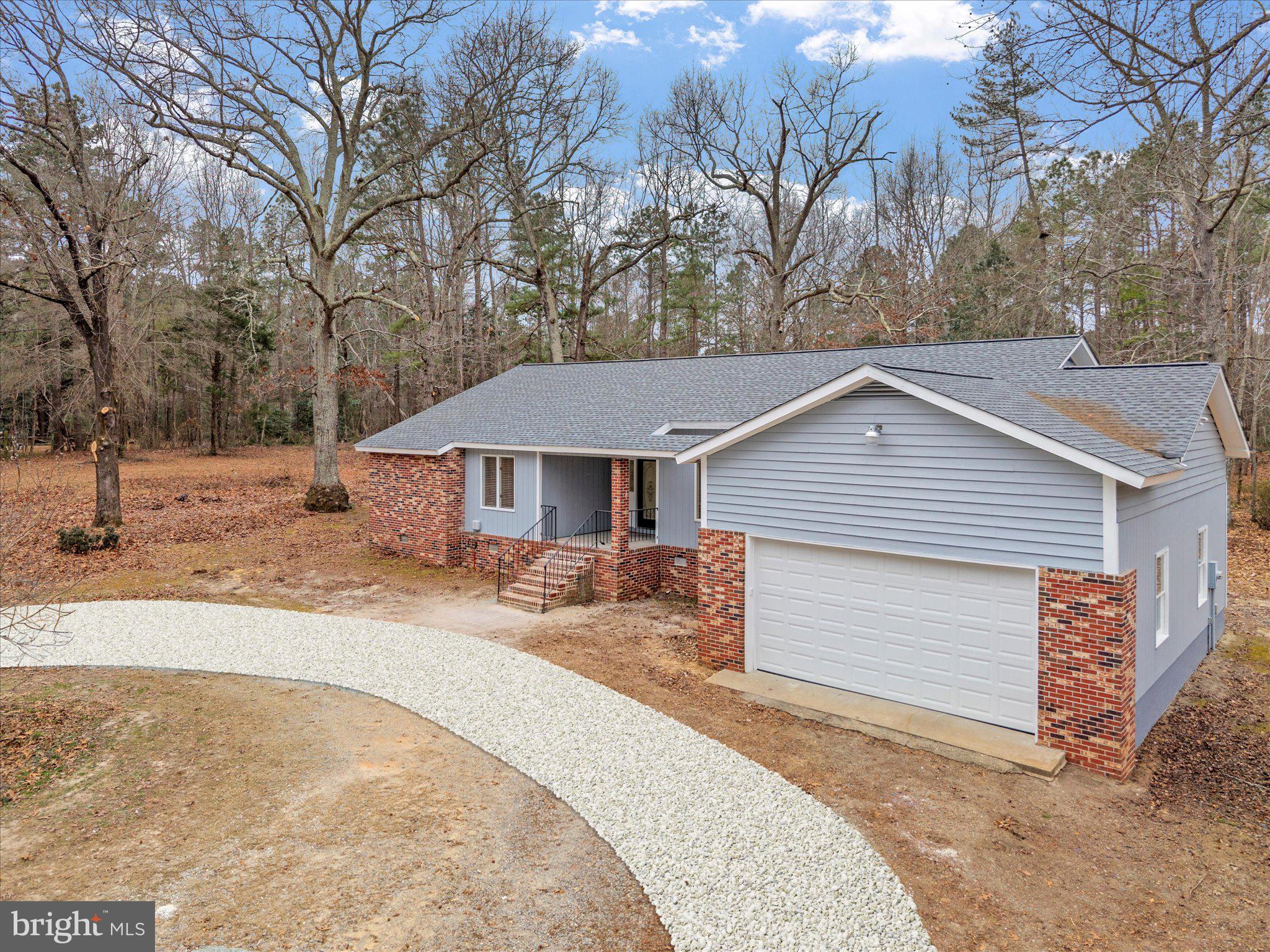 10009 River Road Petersburg, VA 23803 - Photo 51 of 59 a front view of a house with a yard