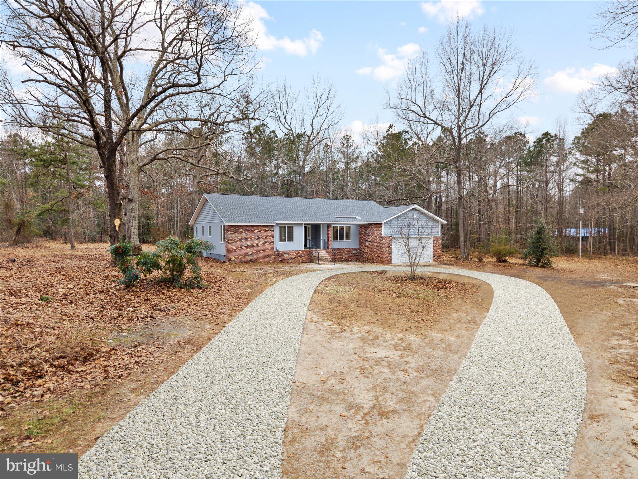 10009 River Road Petersburg, VA 23803 - Photo 52 of 59 a front view of a house with a yard covered in snow
