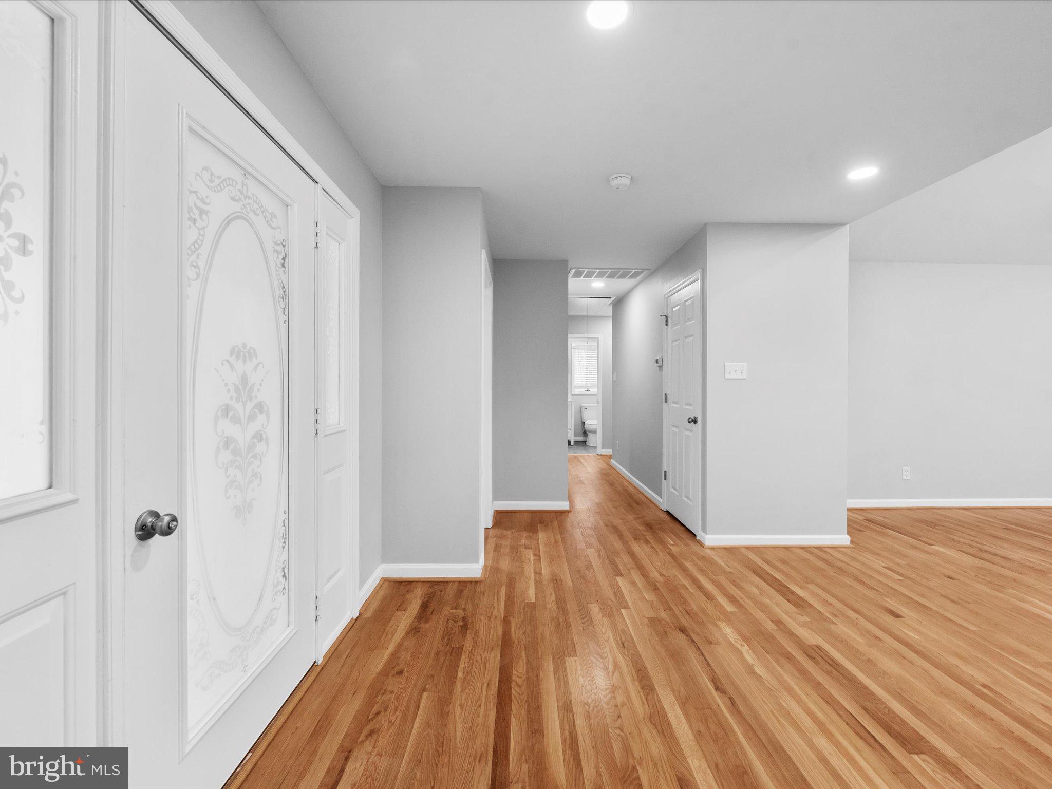 10009 River Road Petersburg, VA 23803 - Photo 6 of 59 a view of a big room with wooden floor and a bathroom