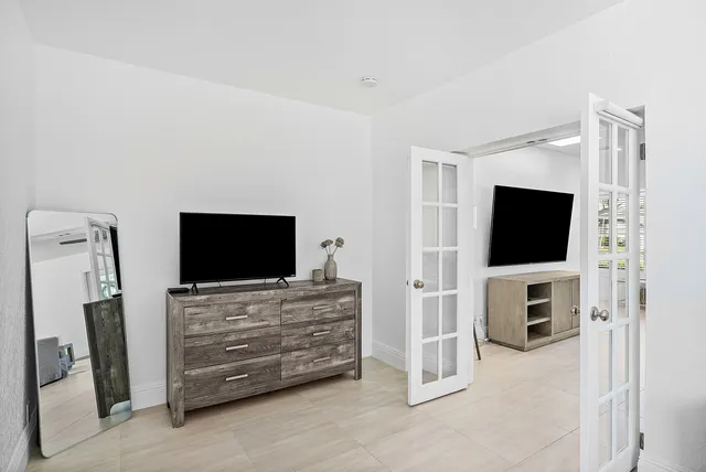 a room with furniture and flat screen tv