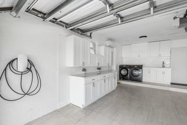a view of a kitchen with a sink and cabinets