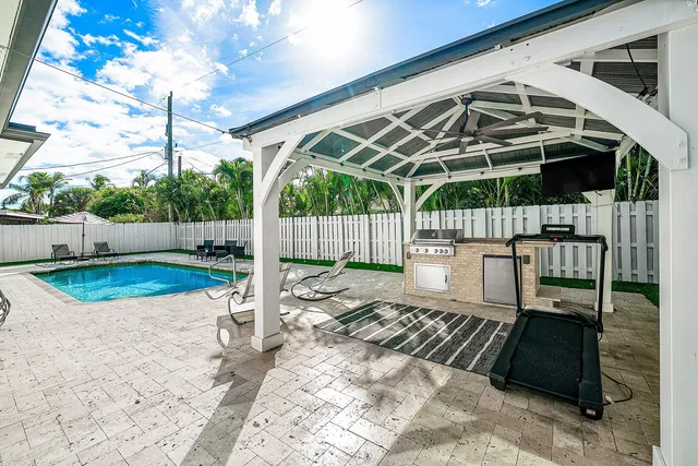 a view of a backyard with sitting area
