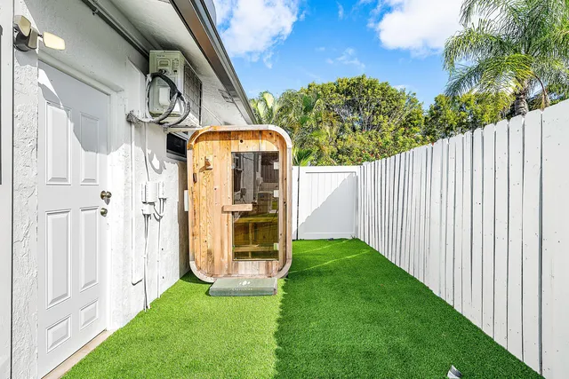an aerial view of house with yard swimming pool and outdoor seating