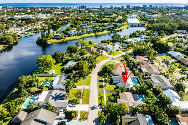 an aerial view of a houses with yard