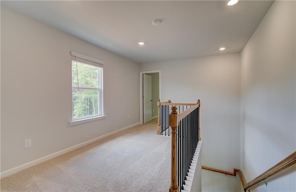 84 Hydrangea Circle Fairburn, GA 30213 - Photo 14 of 23 a view of hallway with stairs