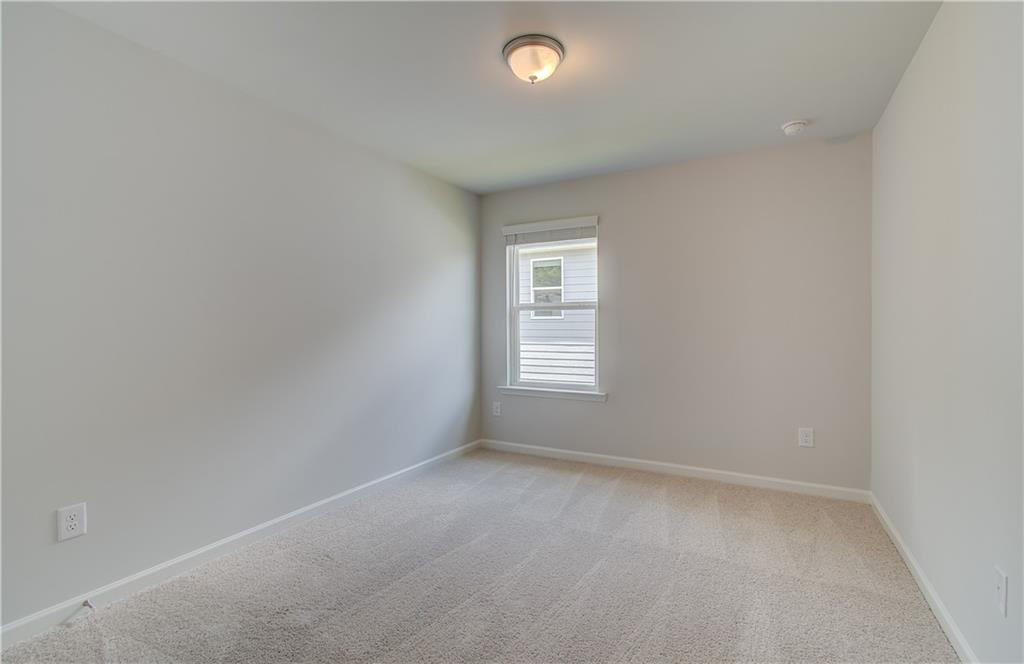 84 Hydrangea Circle Fairburn, GA 30213 - Photo 16 of 23 an empty room with a window