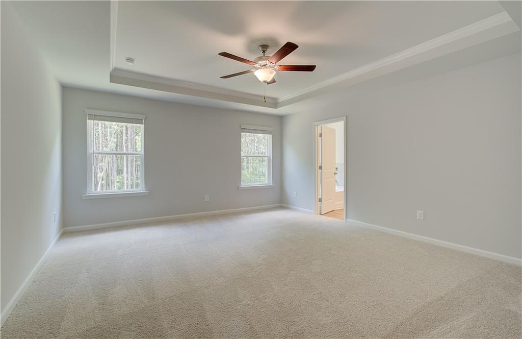 84 Hydrangea Circle Fairburn, GA 30213 - Photo 19 of 23 a view of an empty room with a window
