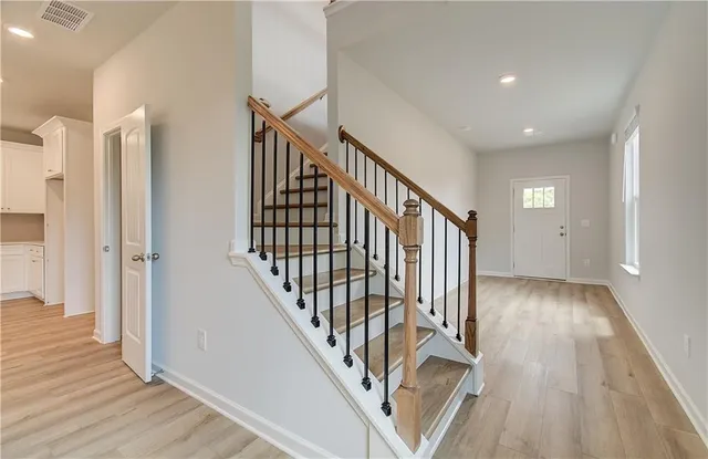 a view of entryway with wooden floor