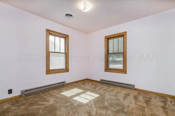 a bathroom with a sink a bathtub and a window
