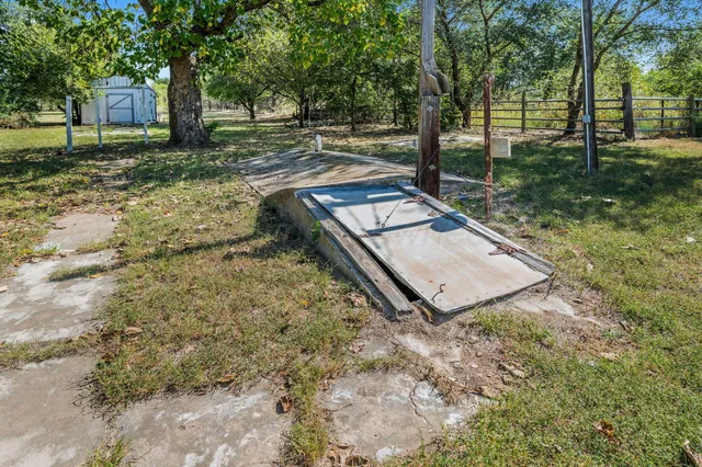 a backyard of house with a yard and garage