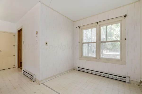 an empty room with windows