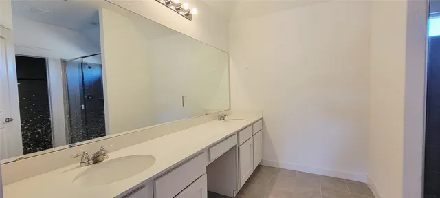 a kitchen with granite countertop a stove and a sink