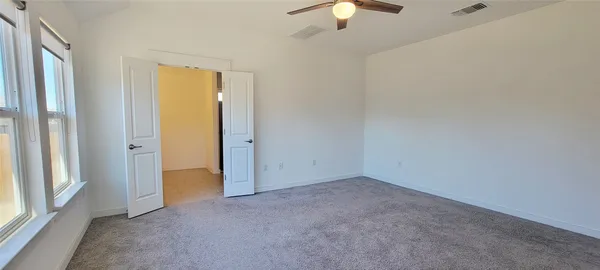 a bathroom with a double vanity sink and mirror