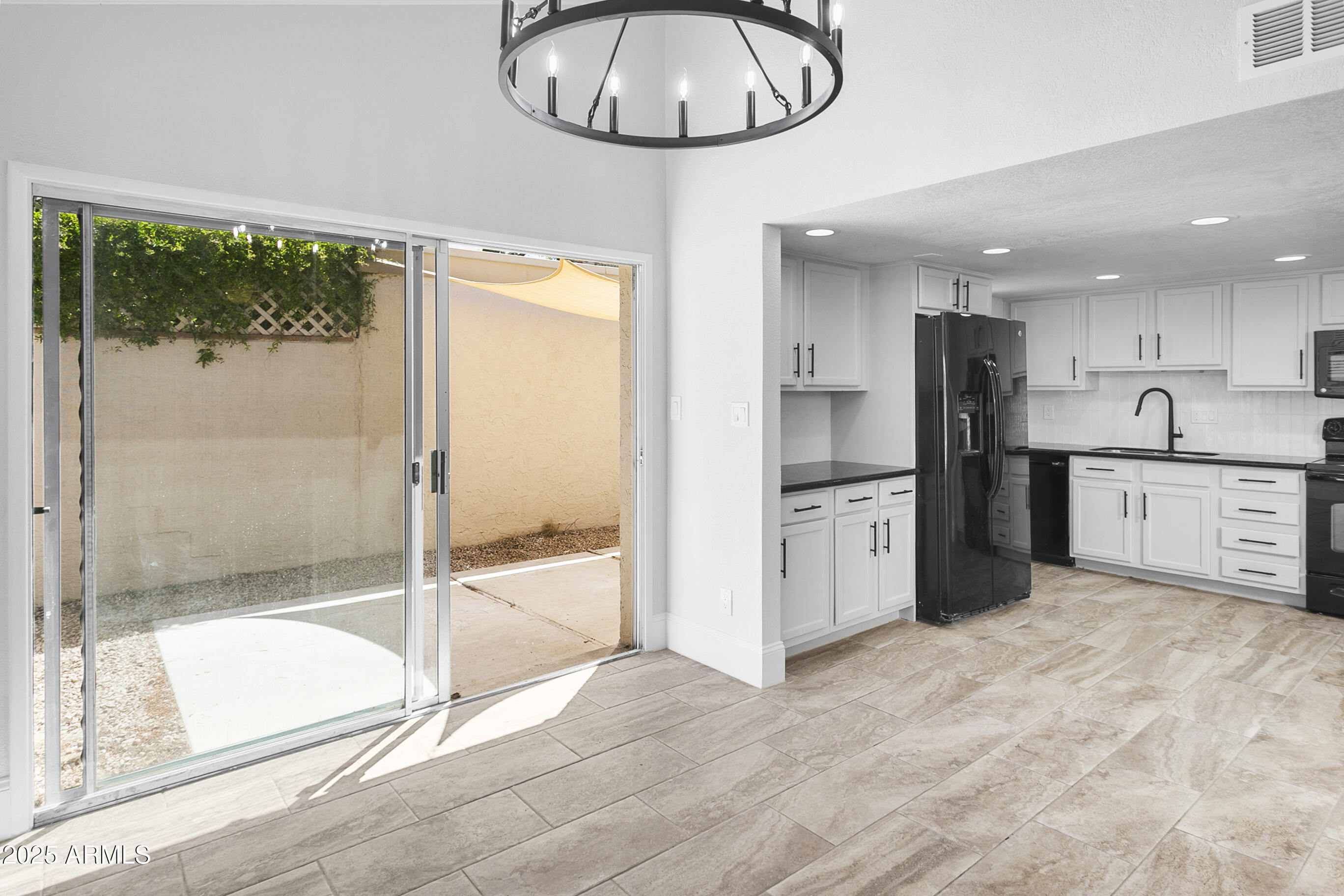 6350 North 78th Street, Unit 290 Scottsdale, AZ 85250 - Photo 12 of 19 a kitchen with stainless steel appliances granite countertop a refrigerator and a sink