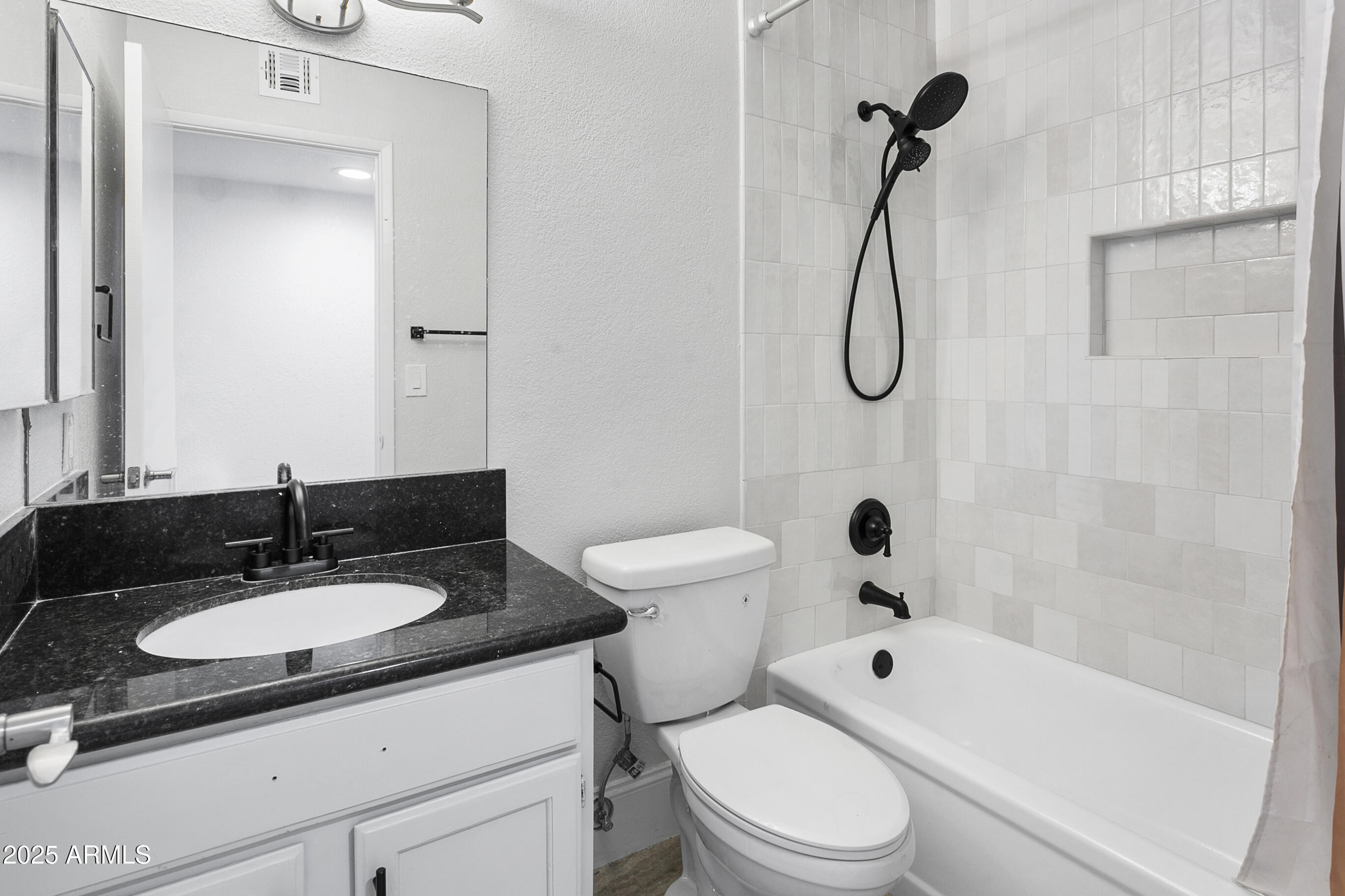 6350 North 78th Street, Unit 290 Scottsdale, AZ 85250 - Photo 14 of 19 a bathroom with a sink toilet tub and shower