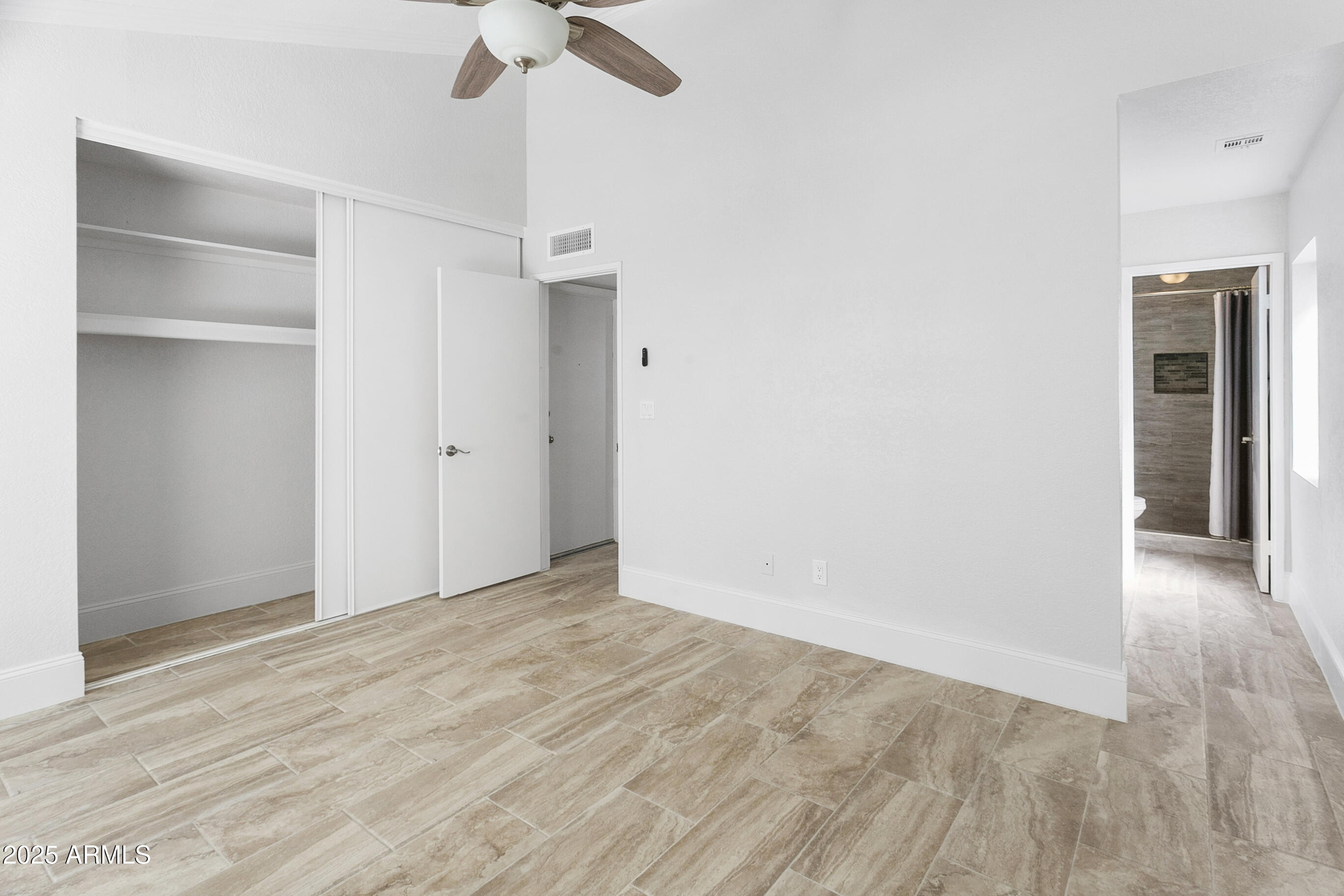 6350 North 78th Street, Unit 290 Scottsdale, AZ 85250 - Photo 16 of 19 a view of an empty room with a ceiling fan