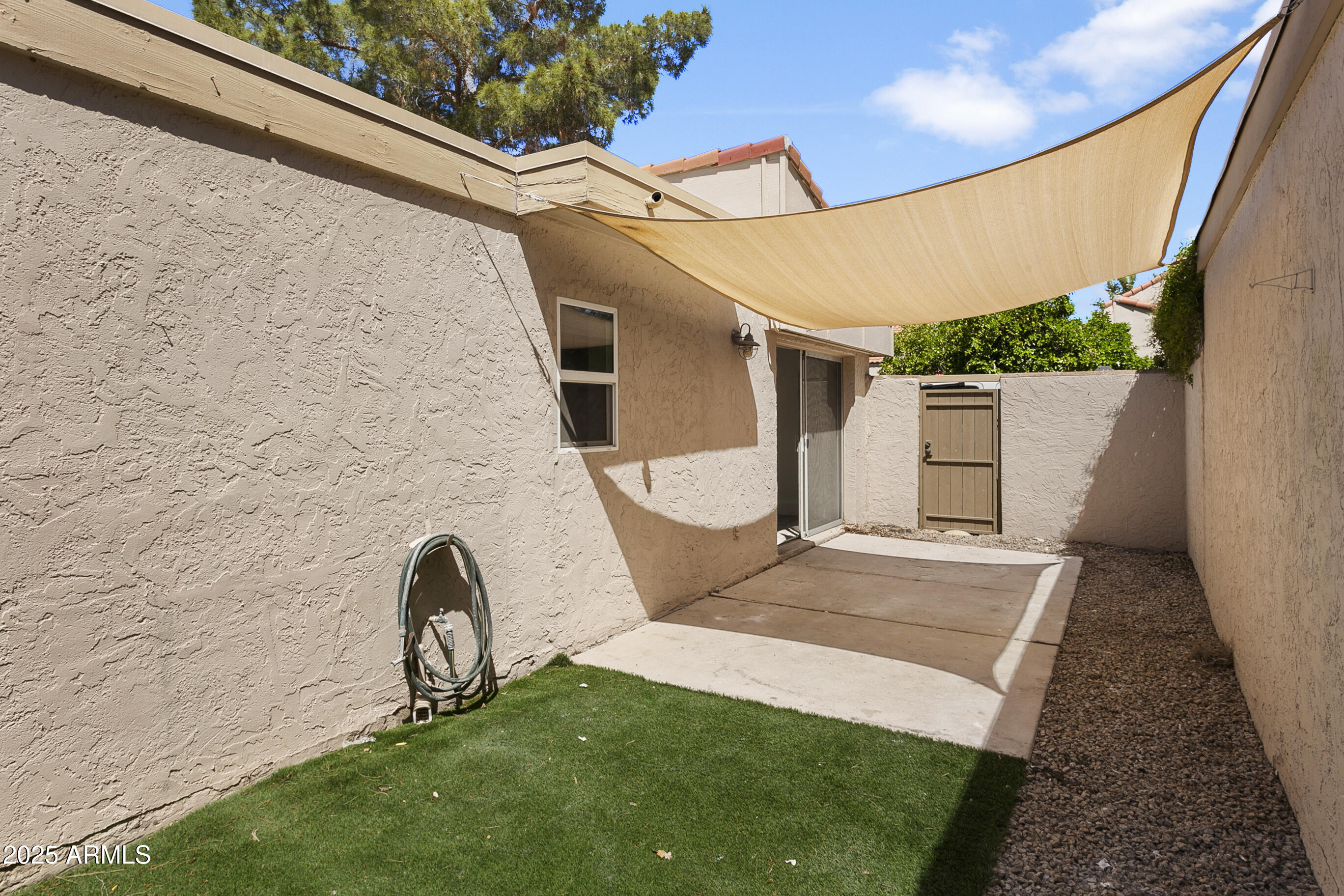 6350 North 78th Street, Unit 290 Scottsdale, AZ 85250 - Photo 19 of 19 a front view of a house with garden