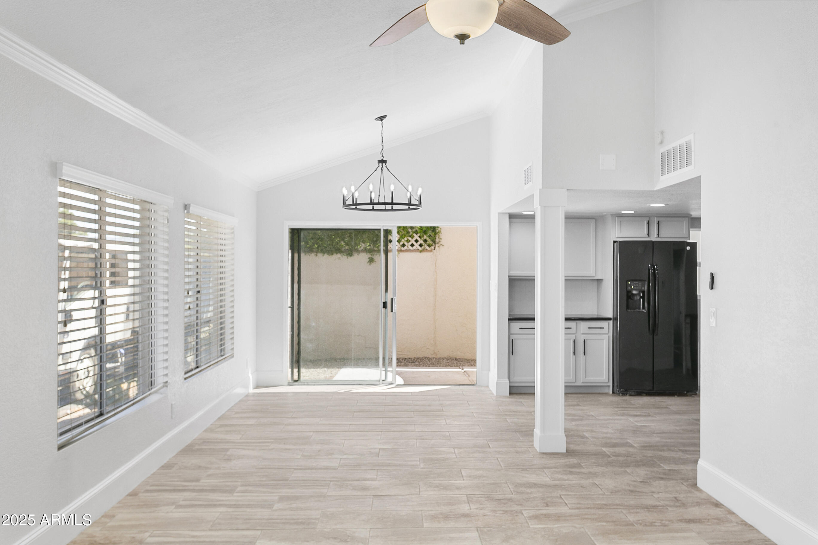 6350 North 78th Street, Unit 290 Scottsdale, AZ 85250 - Photo 3 of 19 a view of a hallway with a chandelier