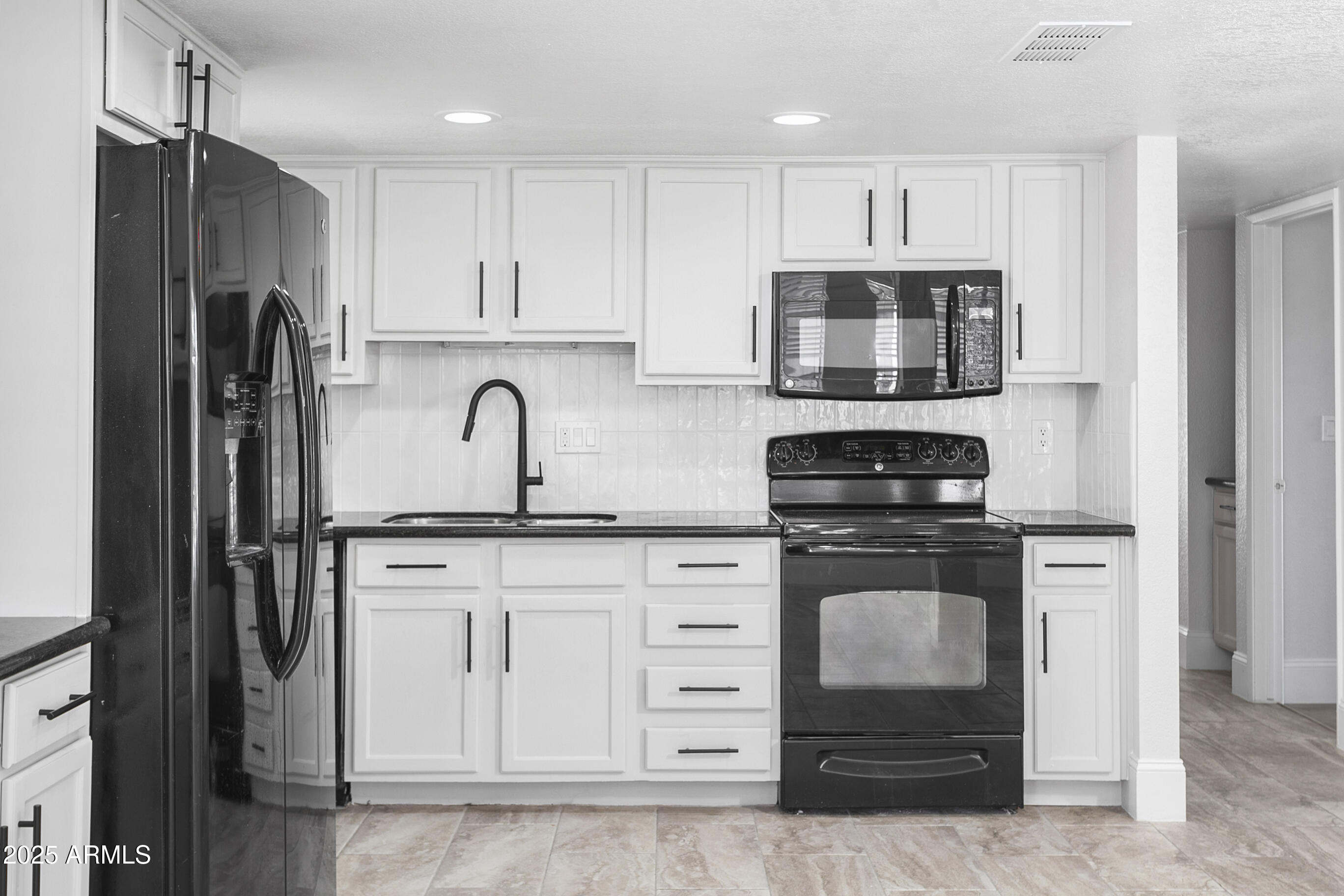 6350 North 78th Street, Unit 290 Scottsdale, AZ 85250 - Photo 6 of 19 a kitchen with stainless steel appliances granite countertop a refrigerator sink and stove
