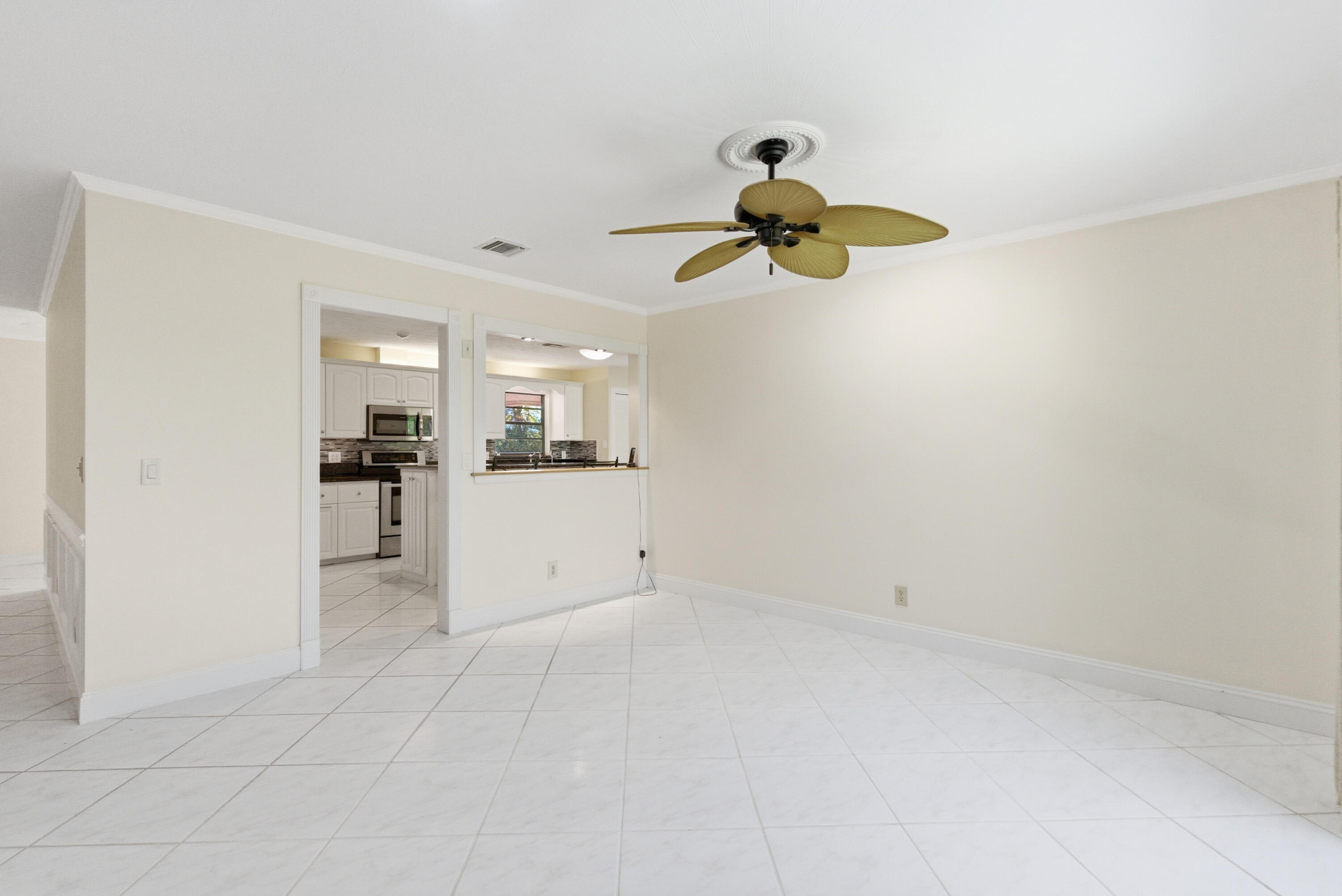 5151 Southeast Burning Tree Circle Stuart, FL 34997 - Photo 21 of 74 a view of a kitchen with a sink and dishwasher cabinet