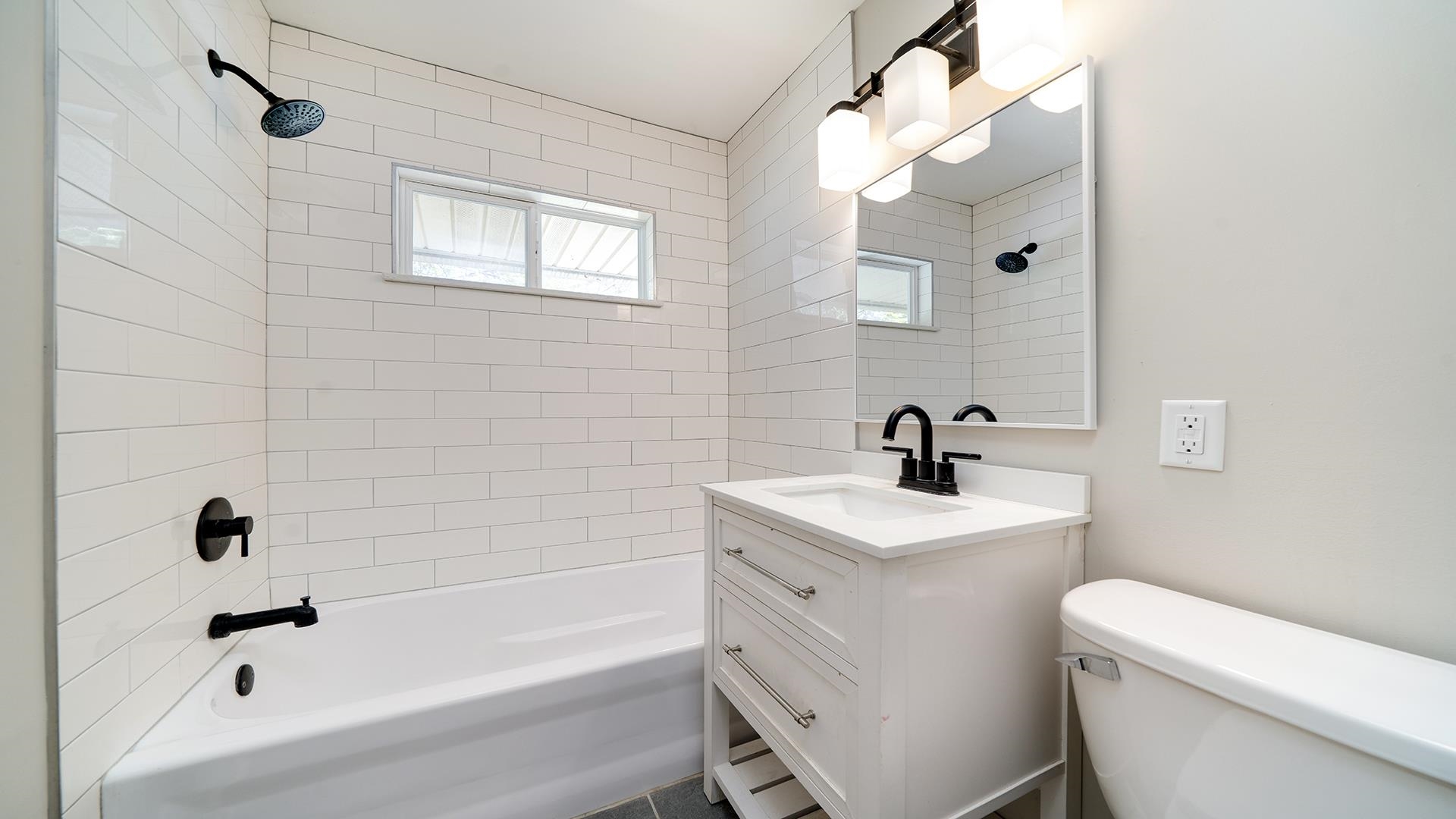 4604 Mohawk Road Rockford, IL 61107 - Photo 14 of 30 a bathroom with a sink a toilet and shower