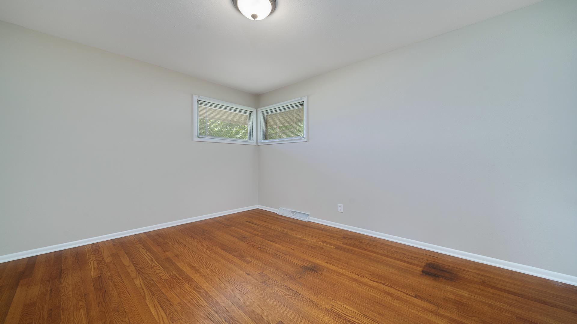 4604 Mohawk Road Rockford, IL 61107 - Photo 17 of 30 a view of an empty room with wooden floor and a window