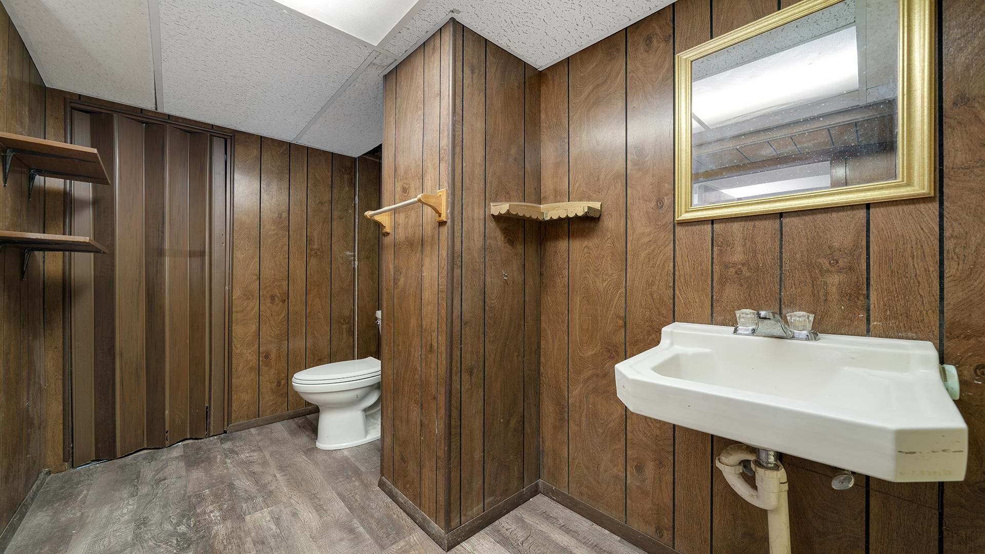 4604 Mohawk Road Rockford, IL 61107 - Photo 23 of 30 a bathroom with a sink a toilet and shower
