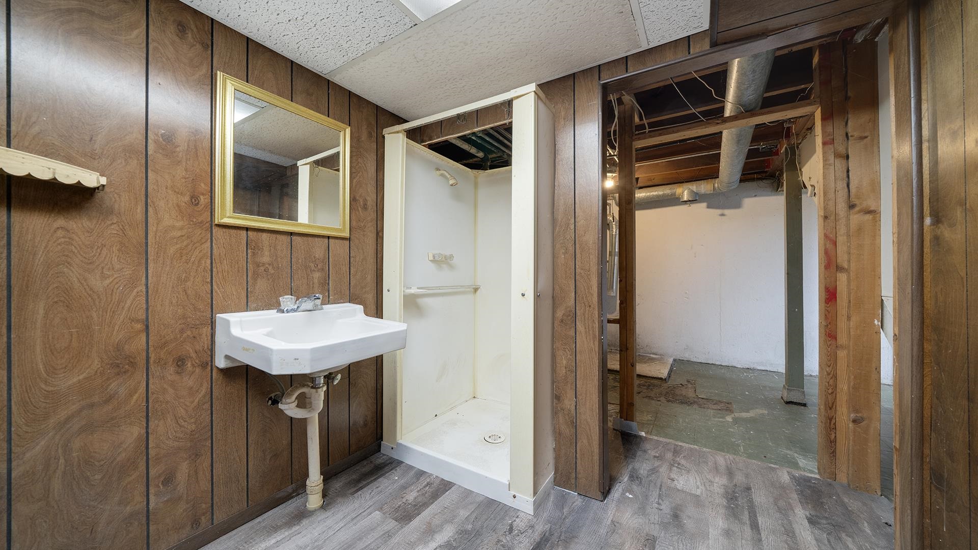 4604 Mohawk Road Rockford, IL 61107 - Photo 24 of 30 a bathroom with a sink a mirror and shower