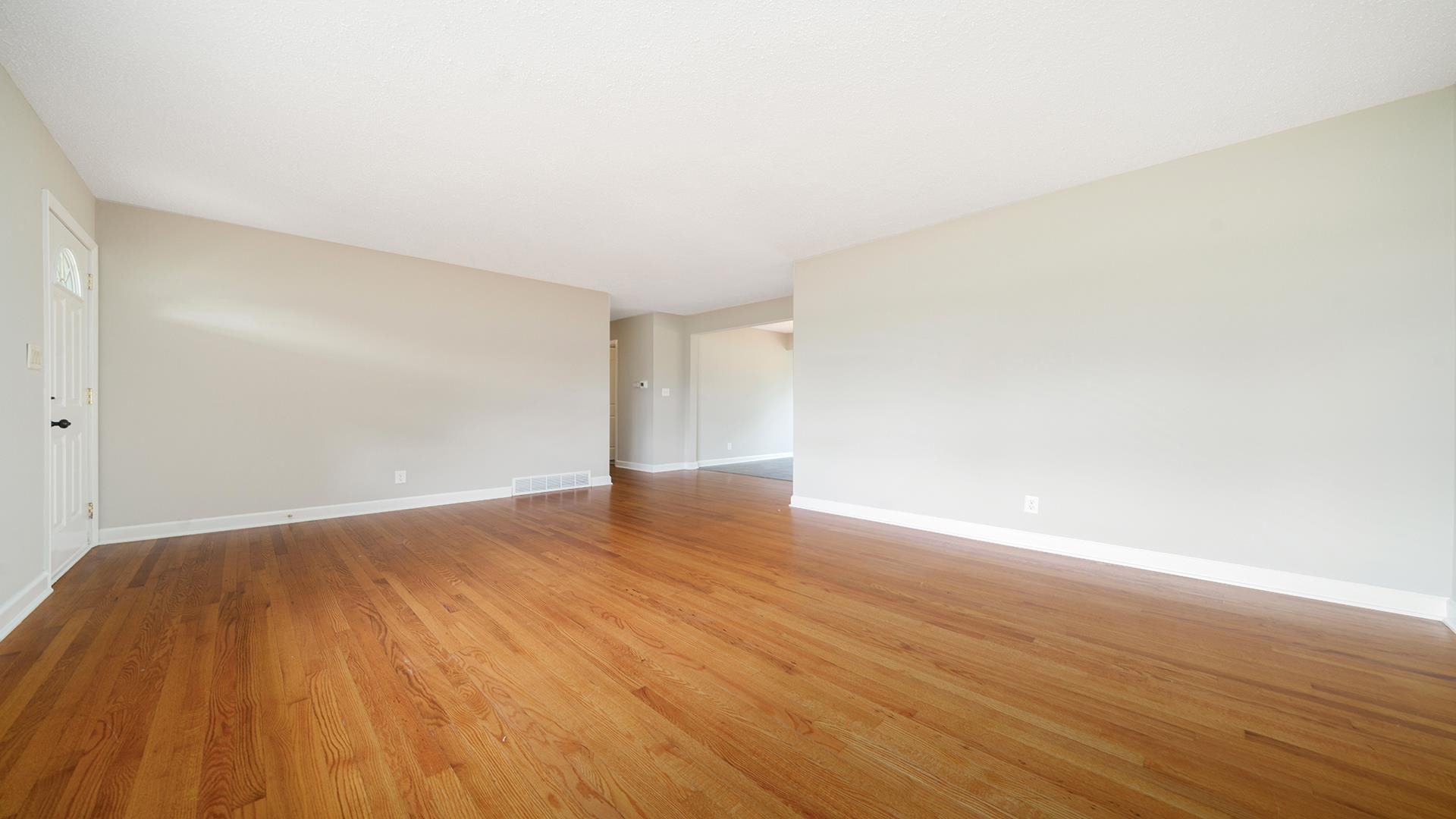 4604 Mohawk Road Rockford, IL 61107 - Photo 5 of 30 a view of an empty room with wooden floor and fan