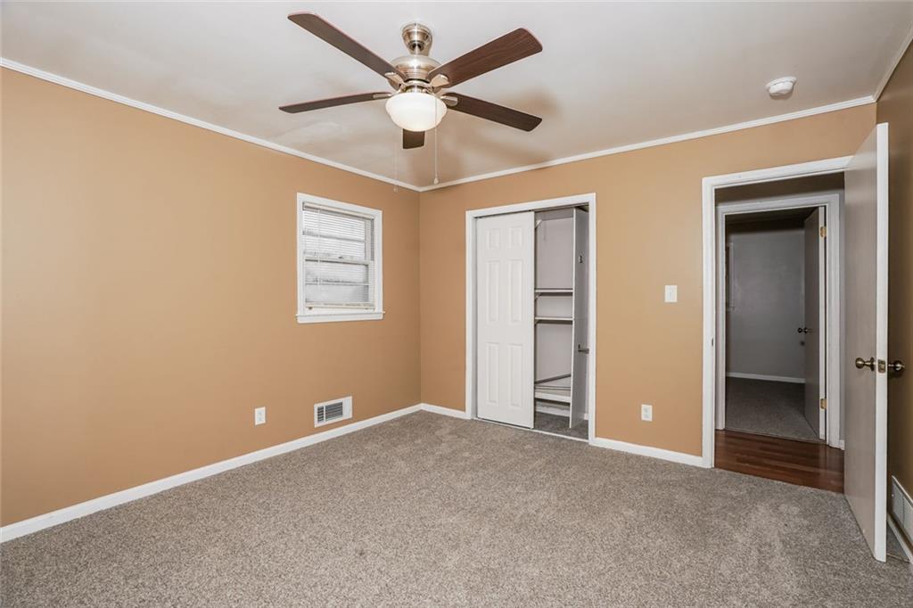 1320 North Cherokee Avenue Griffin, GA 30224 - Photo 15 of 20 a view of an empty room with a ceiling fan