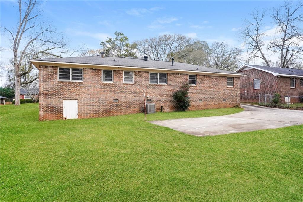 1320 North Cherokee Avenue Griffin, GA 30224 - Photo 19 of 20 a front view of a house with a yard and garage