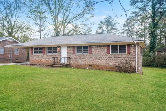 front view of a house with a yard