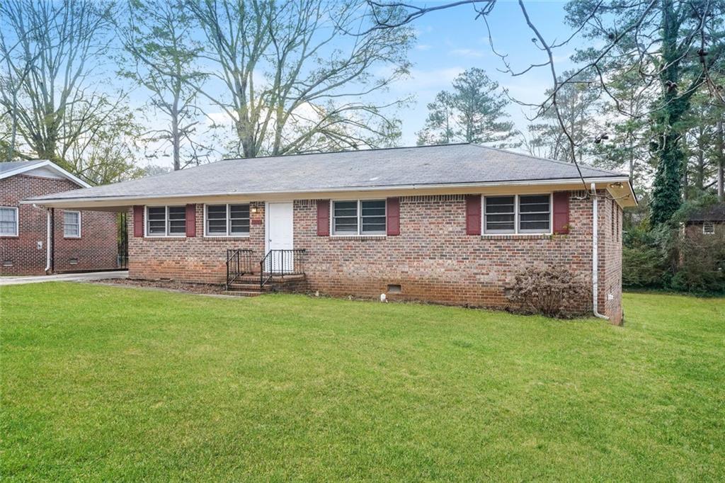 1320 North Cherokee Avenue Griffin, GA 30224 - Photo 2 of 20 front view of a house with a yard
