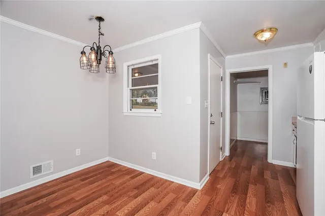 a view of livingroom with hardwood floor and hallway