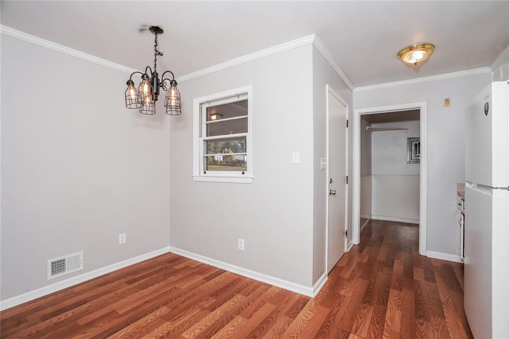 1320 North Cherokee Avenue Griffin, GA 30224 - Photo 6 of 20 a view of livingroom with hardwood floor and hallway