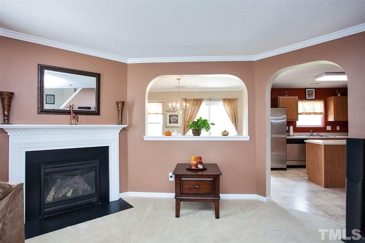 6838 Harter Court Raleigh, NC 27610 - Photo 2 of 25 Wow! Majestic fireplace angled for effect is stunning!