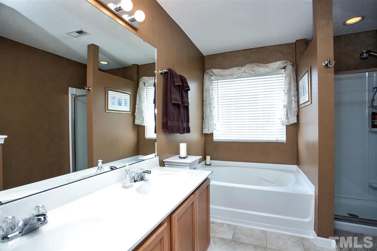 6838 Harter Court Raleigh, NC 27610 - Photo 11 of 25 Double vanity ... over sized mirror ... lots of storage