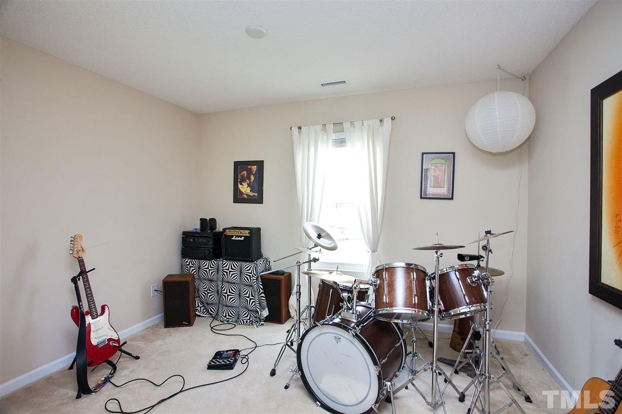 6838 Harter Court Raleigh, NC 27610 - Photo 17 of 25 Having two extra bedrooms also provides additional versatility. These home owners used one of the extra bedrooms for band practice!