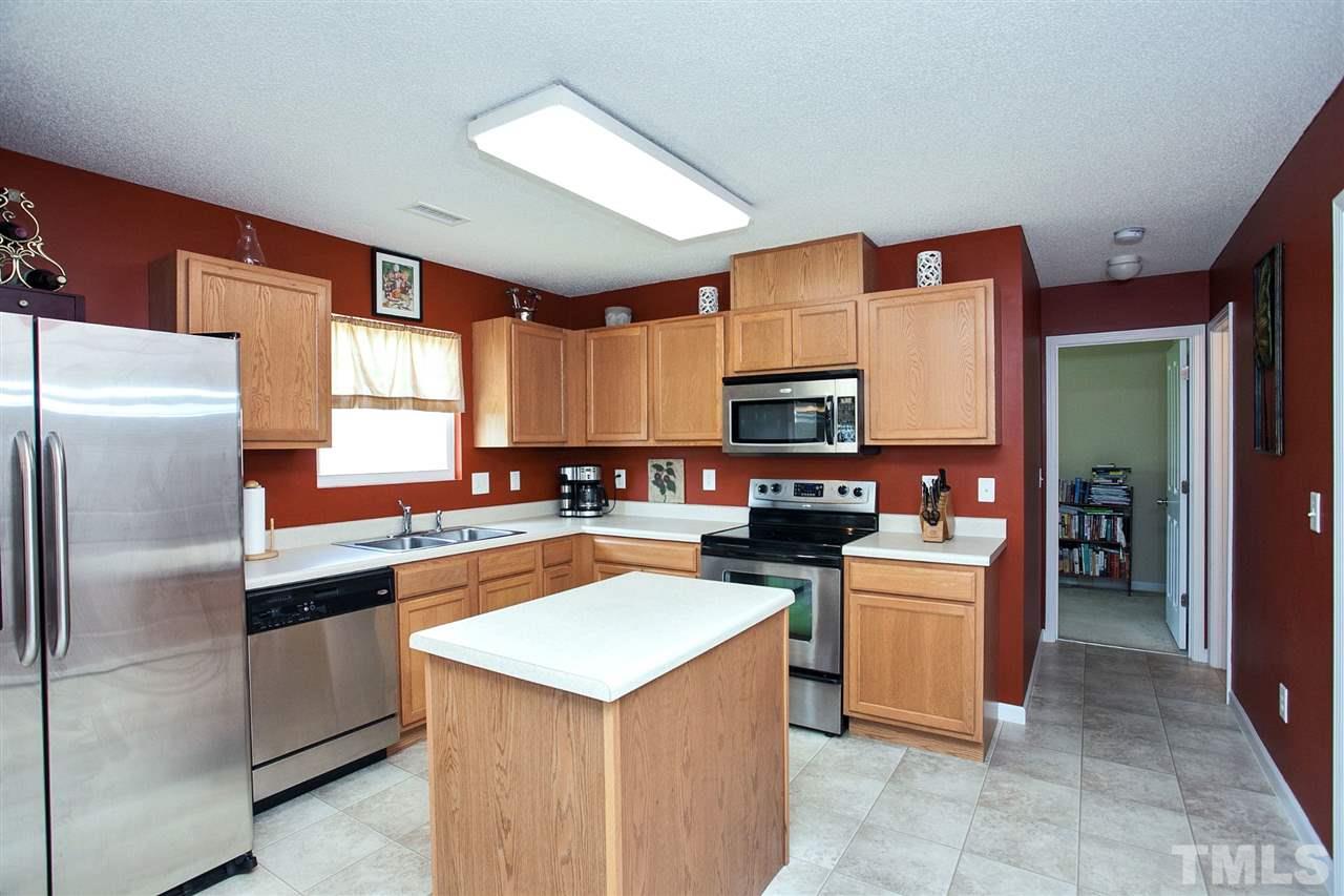 6838 Harter Court Raleigh, NC 27610 - Photo 5 of 25 Inviting Kitchen features a center island, pantry and lots of storage ...