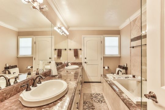1509 Welcome Way Ridgecrest, CA 93555 - Photo 31 of 50 a large spacious bathroom with a double vanity sink a mirror and a bathtub