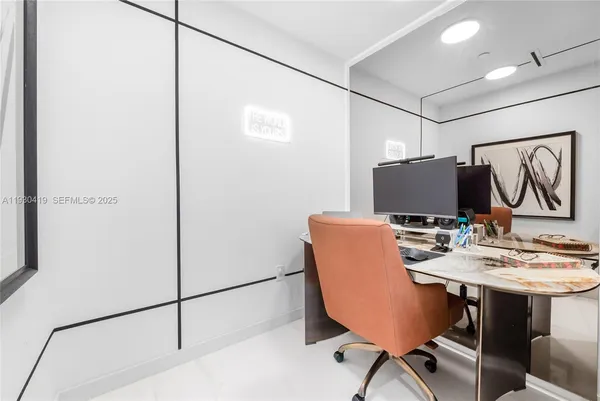 a view of a workspace with furniture