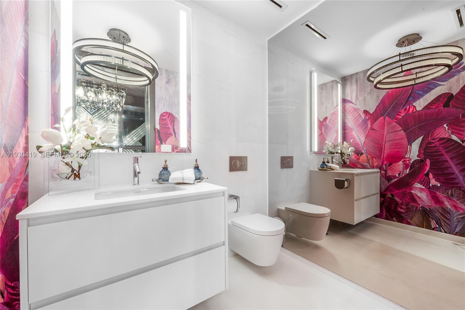 300 Biscayne Blvd Way, Unit 5104 Miami, FL 33131 - Photo 23 of 35 a bathroom with a sink toilet mirror and vanity